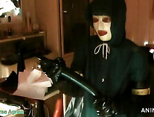 Rubbernurse Agnes - Green Heavy Rubber surgical nurse robe with hood - deep pegging with 2 long rubber colonoscopes and final ro