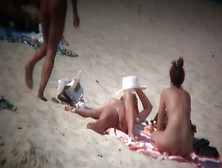 Mature Blonde Spreading Her Shaved Pussy On The Beach