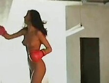 Hot brunette is punching bag nude and then masturbates