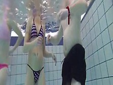 Dirty girls jerk my cock in the middle of the pool