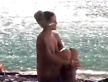 Araceli looks for a guy to screw around a nude beach