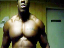 Thick Dark-Hued Bodybuilder Flexing Up Close Grunting