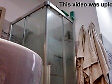 Concupiscent blond shows her melons in the bath stall