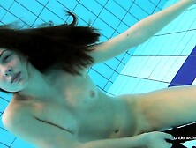 Red swimsuit hottie Katy with bushy twat underwater