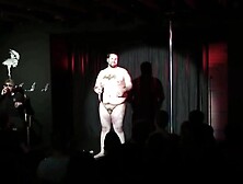 Fat guy gets naked on stage