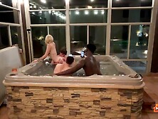 Sexy blonde Ellie Smoke is sucking two cocks in the bathtub