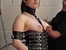 Brunette In Corset Chained To Get Clit Stimulation And Fisting