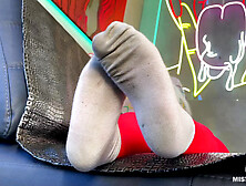 Wiggling my toes for you in red tights and dirty white socks