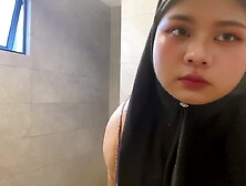 Hijabi sucking her own titties