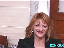 He lightly spanks her ass