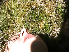 Amazing redhead with small tits masturbates her wet pussy with a dildo outdoors