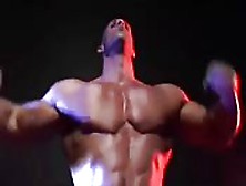 Huge Bodybuilder Showing Off On Stage