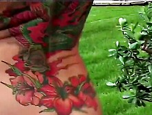 Tattooed Milf Outside In The Backyard