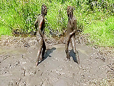 two girls Jane in mud
