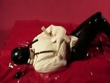 Girl In Black Latex Catsuit Mask With Straightjacket A Gagged Breath Play