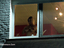 Alluring Girlie In Glasses And Red Shoes Kicking Back In The Living Room.